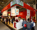 Visible from afar in striking KRONO red: the stand of the SWISS KRONO GROUP.