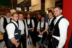 Future master carpenters in a good mood at the stand of the SWISS KRONO GROUP.